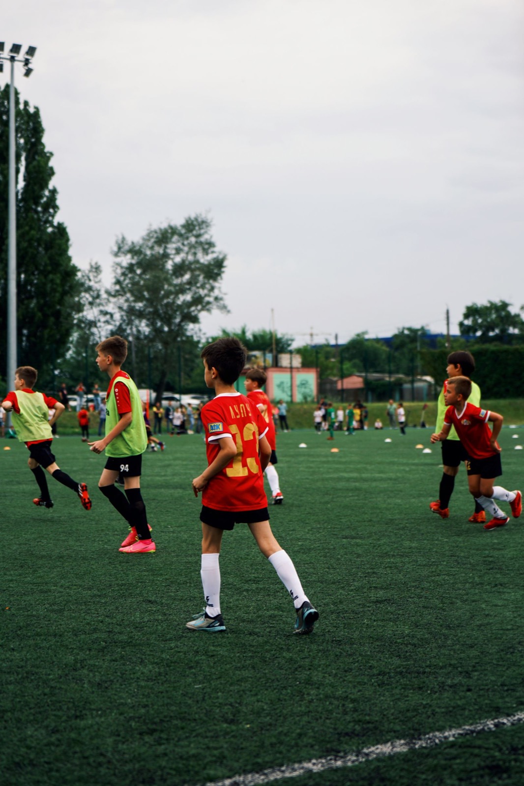 Children enjoying a multi-sport PE session on a sports pitch