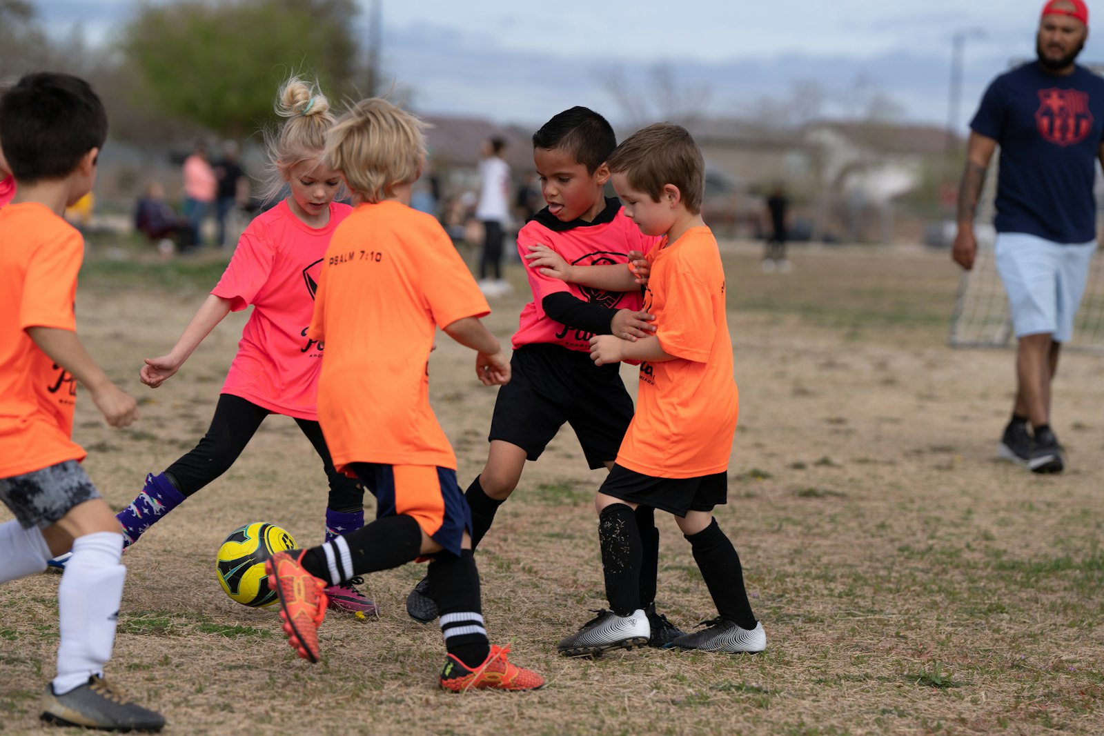 Children playing an energetic after-school football activity outdoors